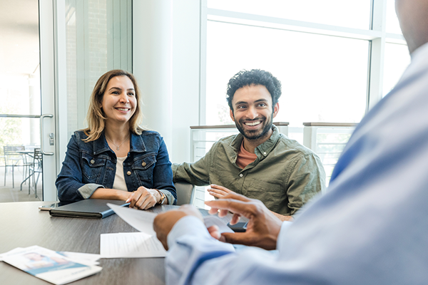 A couple meets with an advisor to discuss term deposits.